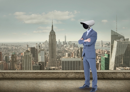 Digital composite of Businessman with CCTV head with city skylineの写真素材