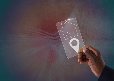 Digital composite of hands holding glass interfaceの写真素材