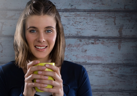 Digital composite of Woman against wood with cupの写真素材