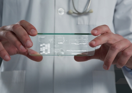 Digital composite of hands holding glass interfaceの写真素材