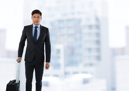 Digital composite of Businessman standing in front of cityの写真素材