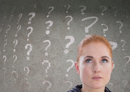 Digital composite of woman looking up at question mark