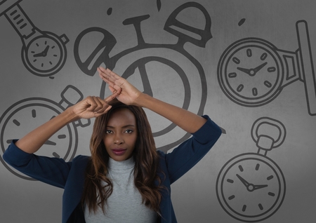 Digital composite of Frustrated woman in front of clocksの写真素材