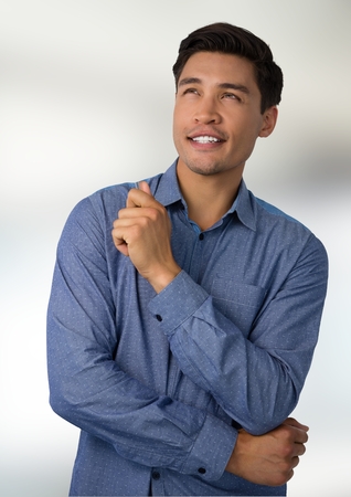 Digital composite of Businessman thinking with bright backgroundの写真素材