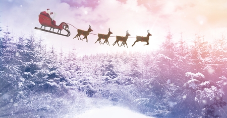 Digital composite of Winter landscape and Santa's sleigh and reindeer'sの写真素材
