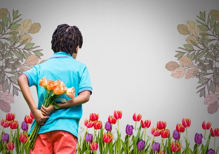 Digital composite of Boy against grey garden background with bunch of flowers behind backの写真素材