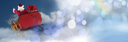 Digital composite of Cloudy sky transition of Santa's sleigh and reindeer'sの写真素材