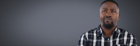 Digital composite of man thinking with grey backgroundの写真素材