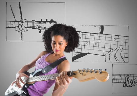Digital composite of Young woman playing guitar against grey background and guitar illustrations learningの写真素材