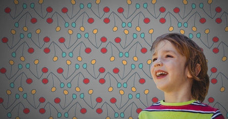 Digital composite of Boy against grey background happy and colorful pattern