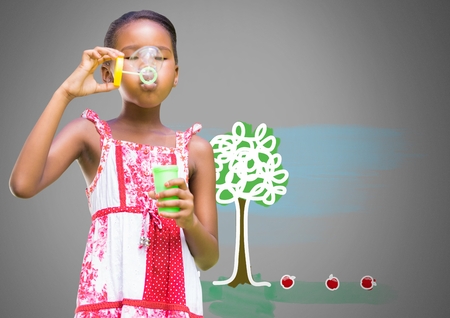 Digital composite of Girl against grey background blowing bubbles and tree drawingの写真素材