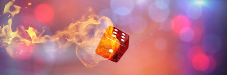 Computer graphic image of 3D dice against fireの写真素材