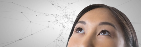 Digital composite of Woman looking up with connected scientific patterns backgroundの写真素材