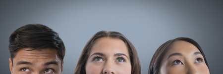 Digital composite of Three people looking up with grey background