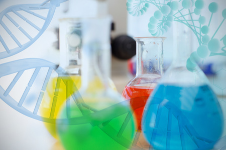 Multiple color chemical  against blue dna helix with medical backgroundの写真素材