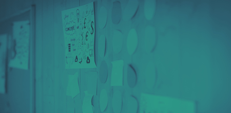 Diagram with adhesive notes on wooden wall in creative officeの写真素材