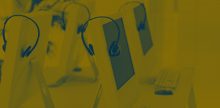 Computers and headsets in empty office
