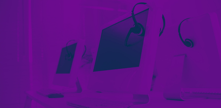 Computers and headsets in empty office
