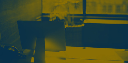 Desktop pc on table in officeの写真素材