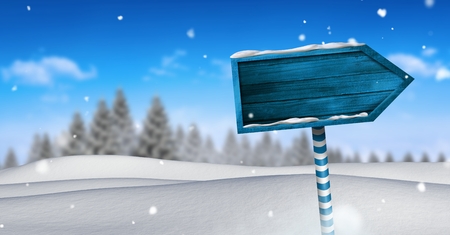 Digital composite of Wooden signpost in Christmas Winter landscapeの写真素材