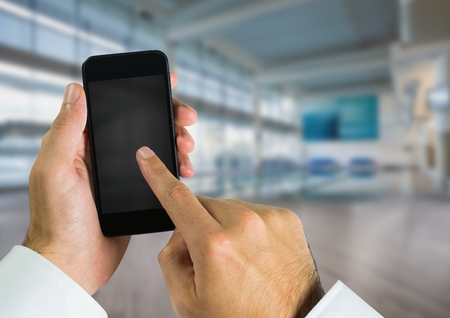 Digital composite of Hand using phone with leisure center large space