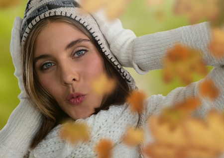 Digital composite of Woman's face in forest with leavesの写真素材