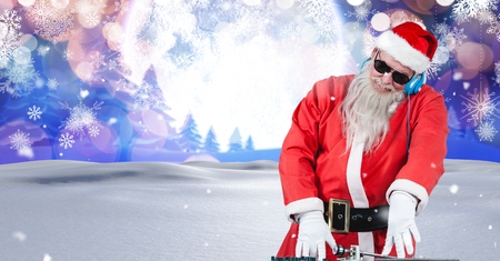 Digital composite of Santa DJ in Christmas Winter landscapeの写真素材