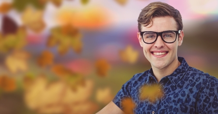 Digital composite of Man's face in forest with leaves and glassesの写真素材