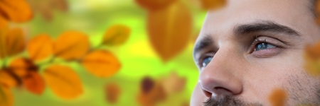 Digital composite of Man's face in forest with leavesの写真素材