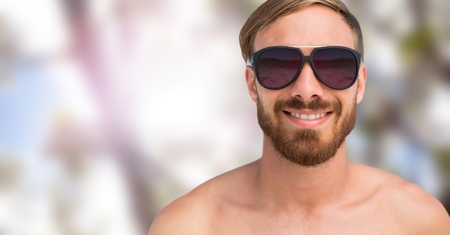 Digital composite of Man's face in forest with leaves and sunglassesの写真素材