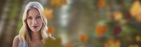 Digital composite of Woman's face in forest with leavesの写真素材