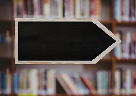 Digital composite of Blackboard arrow sign in library