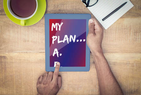 List of plan from a to e  against cropped image of man using on digital tablet