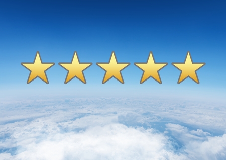 Digital composite of five star review rating in skyの写真素材