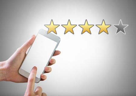 Digital composite of Hand touching phone with star ratings review