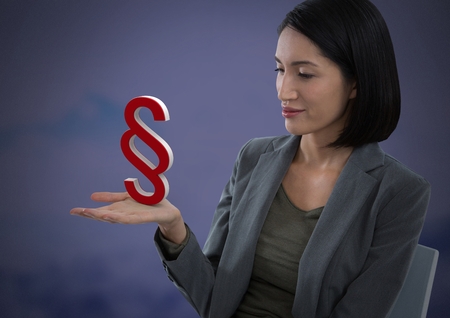 Digital composite of Section symbol icon and Businesswoman with hands palm open and dark backgroundの写真素材