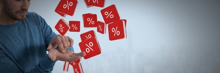Digital composite of Percent icons and Businessman with hands palm open and dark backgroundの写真素材