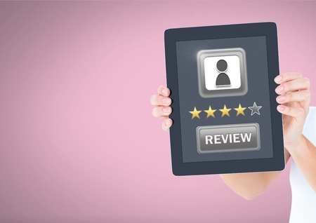 Digital composite of Hand holding tablet with star ratings and review button