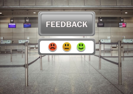 Digital composite of feedback button and smiley satisfaction faces review in airportの写真素材