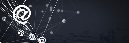 Digital composite of Mixed @ app icons connected and dark backgroundの写真素材