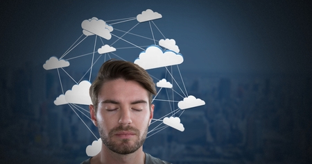Digital composite of Cloud app icons connected and Businessman with eyes closed and dark backgroundの写真素材