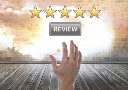 Digital composite of Hand reaching for five star review button ratingの写真素材