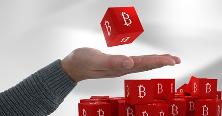 Digital composite of Hand open with bitcoin symbol icons