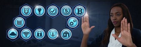 Digital composite of Businesswoman touching various business iconsの写真素材