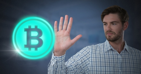 Digital composite of Businessman touching bitcoin graphic iconの写真素材