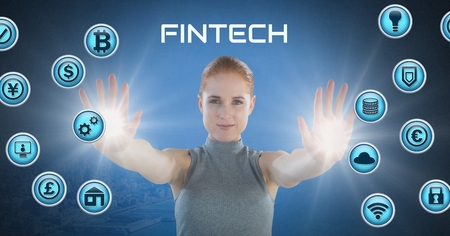 Digital composite of Businesswoman touching Fintech with various business iconsの写真素材