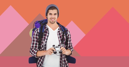 Digital composite of Hiking man with binoculars and minimal shapesの写真素材