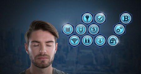 Digital composite of Businessman with eyes closed and various business iconsの写真素材