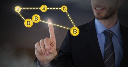 Digital composite of Businessman touching bitcoin graphic icons connectingの写真素材