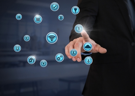 Digital composite of Businessperson touching various business iconsの写真素材